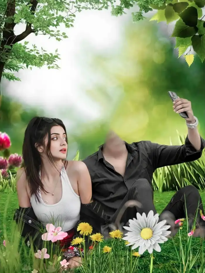 Editing Woman Sitting On Grass Next To A Man Holding A Cell Phone Background