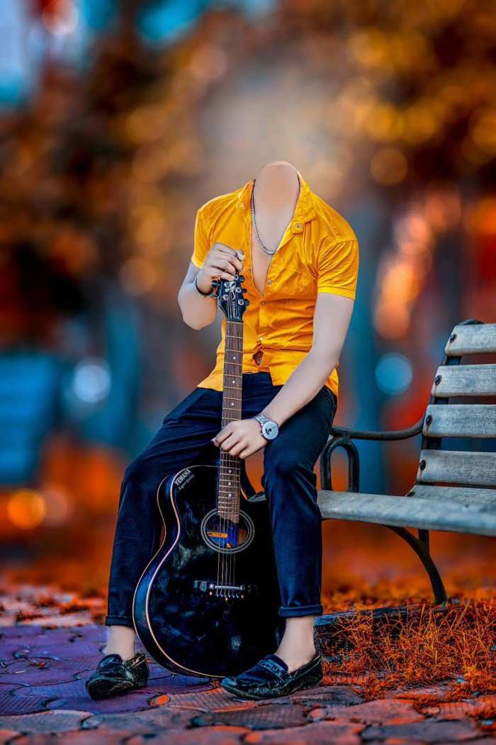 boy holding guitar outdoors posing 7306347 Stock Photo at Vecteezy